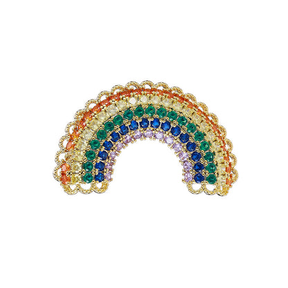 Rainbow brooch with scalloped gold border on white background