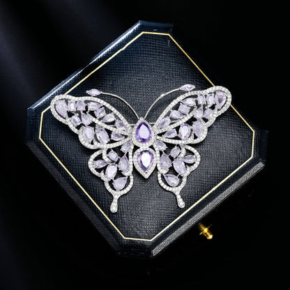 Purple butterfly brooch presented in a gift box