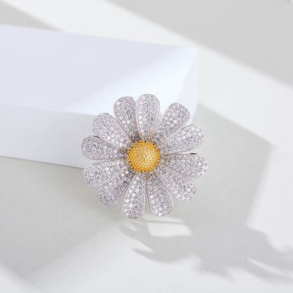 Zircon daisy brooch on white background
