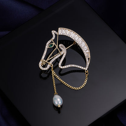 Gold horse head brooch with zircon stones and freshwater pearl drop