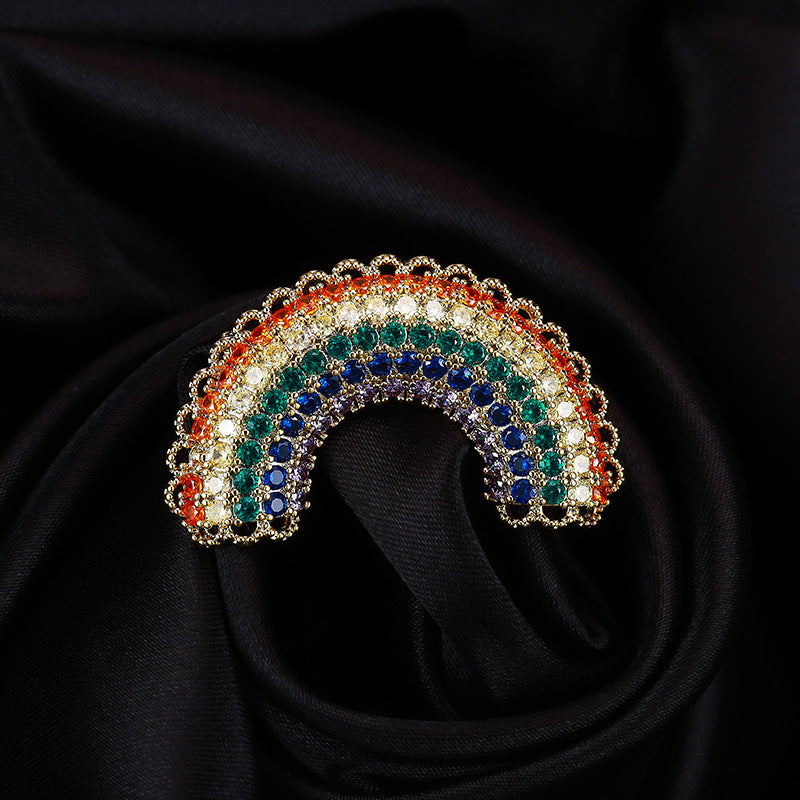 Rainbow zircon arch brooch on black silk