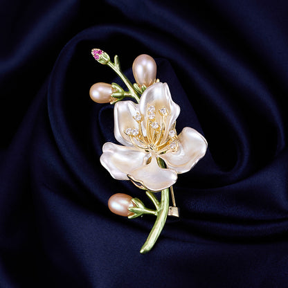 Magnolia brooch on navy silk